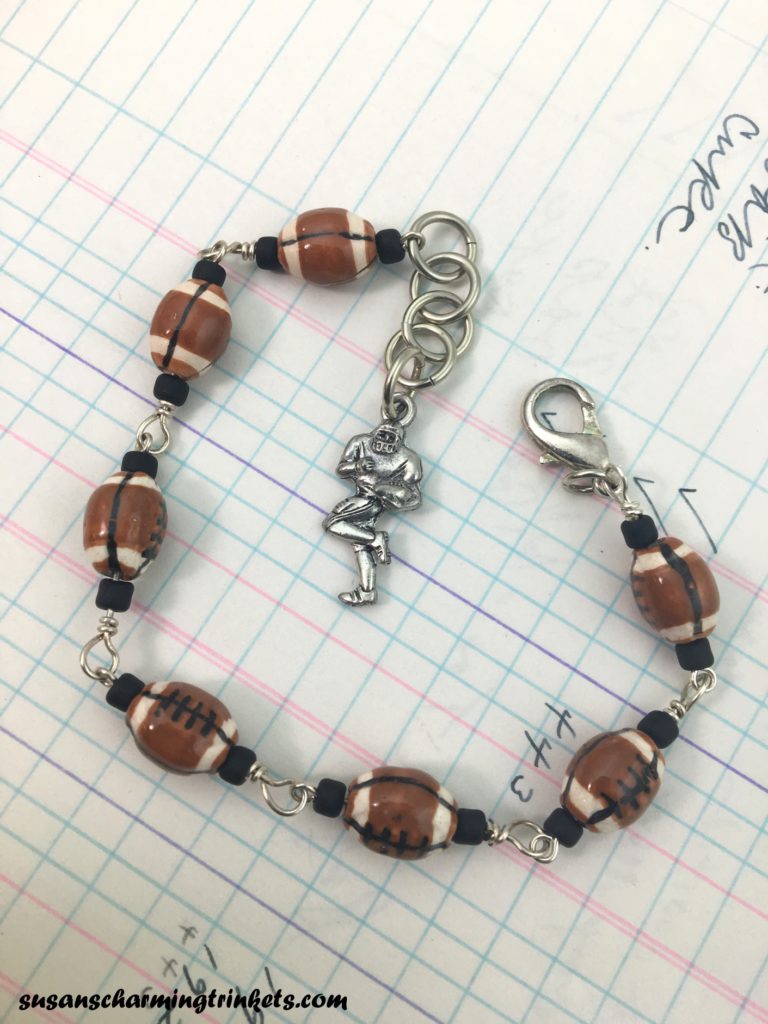 Football Bracelet with tiny ceramic footballs on silver findings with football player charm at the end