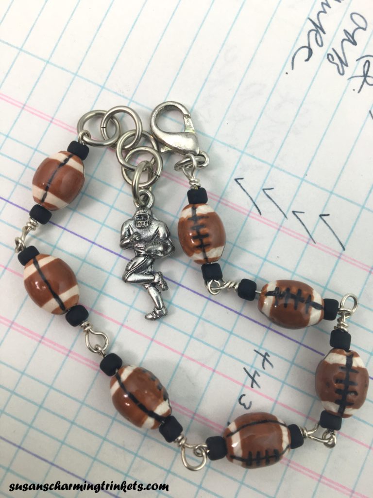 Football Bracelet with tiny ceramic footballs on silver findings with football player charm at the end