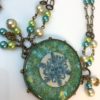 Iridescent Handmade Resin Snowflake in Brass Hobnail Bezel