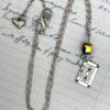 Cassette charm necklace with aurora bead