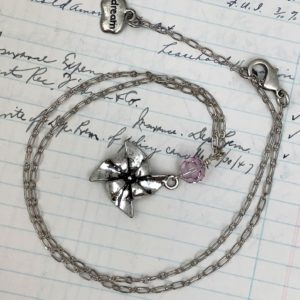 Pinwheel charm necklace with pink bead