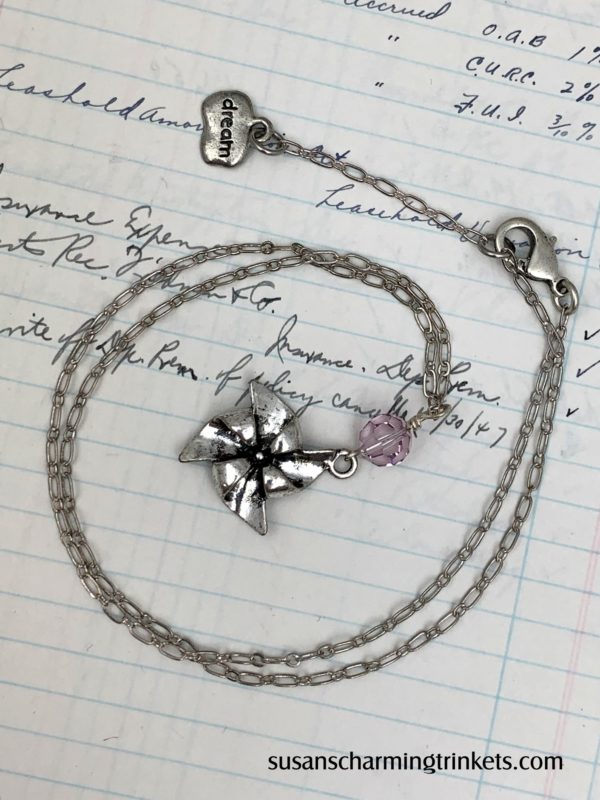 Pinwheel charm necklace with pink bead